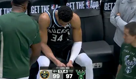 mk体育下载-字母哥在替补席神情落寞，脚部已被缠上厚厚绑带